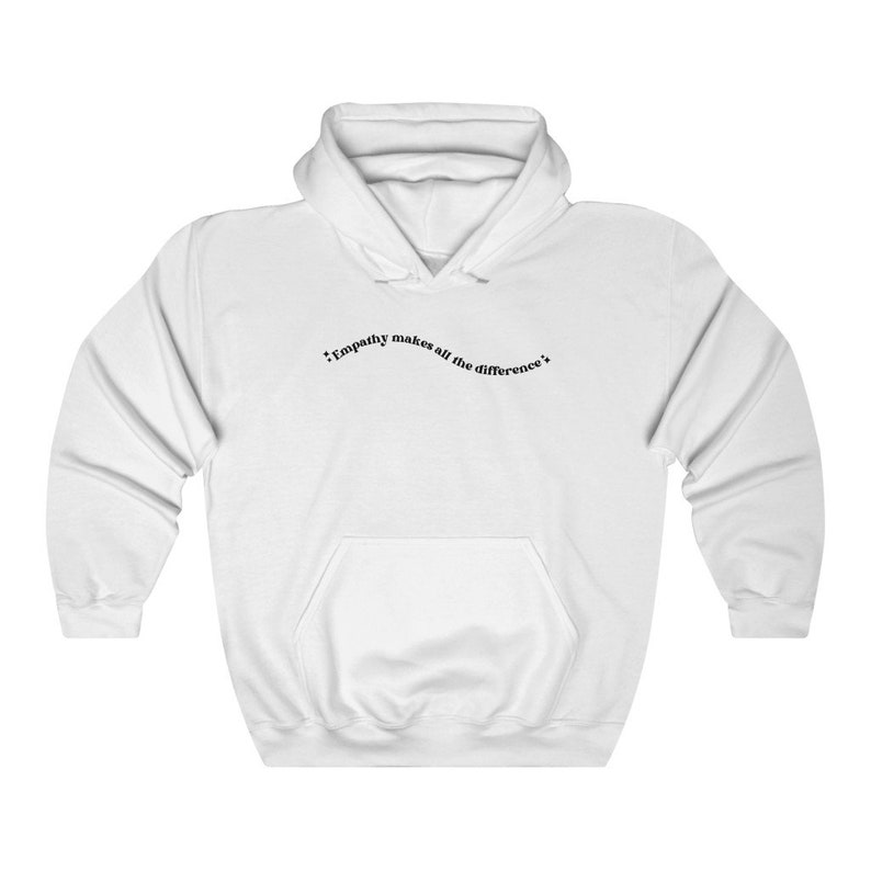 May include: White hooded sweatshirt with the text "Empathy makes all the difference" printed on the front.