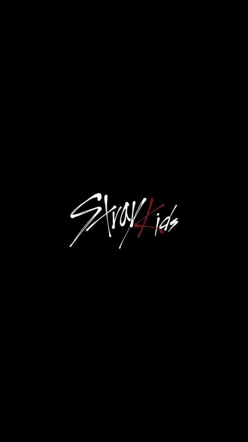 May include: Black background with the white text "Stray Kids" in a handwritten style, with the "K" and "s" in red. The image is a simple, yet bold design, perfect for merchandise.