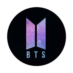 May include: A black circular graphic featuring the letters "BTS" in a light blue font. The letters are below a stylized logo with two vertical, open-ended, purple and blue shapes, resembling open doors or pillars, against a galaxy background.
