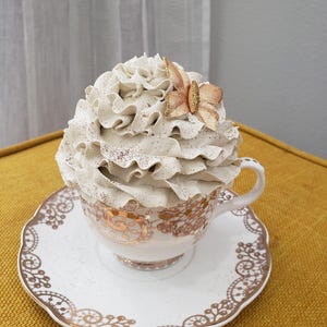 Pip Posh Design Faux Sweet Décor Golden Laced Tea Cup & Ivory Butterfly Whipped Topper Collection