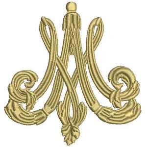 May include: A gold embroidered monogram of the letters "M" and "A" intertwined with ornate floral details. The monogram is a traditional symbol of the Virgin Mary.