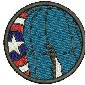 May include: Embroidered patch featuring a blue silhouette of a person with a red, white, and blue star design in the background.