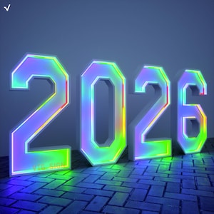 May include: Large, illuminated numbers spelling out "2026" in a vibrant, iridescent colour scheme. The numbers are white with a colourful neon glow around the edges, set against a dark blue background. The numbers are on a brick-like surface.