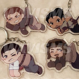 May include: Four acrylic keychains featuring cartoon characters in various poses. Each keychain has a silver keyring and chain. The characters are depicted in a chibi style, with exaggerated features and expressions. The keychains are on a soft, white background.