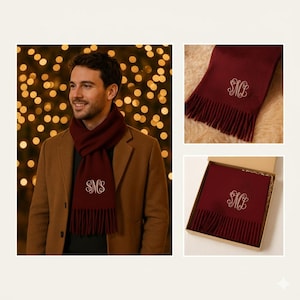 May include: Burgundy scarf with white embroidered initials. The scarf has a fringed edge and is displayed in multiple views, including worn and boxed. The scarf is shown on a person wearing a brown coat.