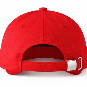 May include: A vibrant red baseball cap, viewed from the back, showcasing a curved brim and adjustable strap. The cap features a metal clasp for size adjustment. The design is simple and classic, suitable for casual wear.