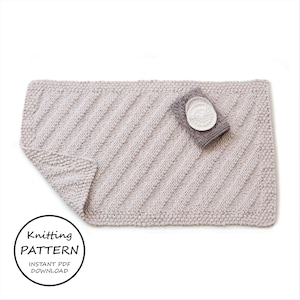 May include: A knitting pattern for a light pink, rectangular rug with a diagonal stitch pattern. The pattern is available as an instant PDF download.