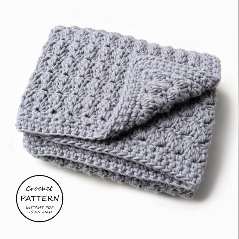 May include: A gray crocheted blanket folded on a white surface. The text "Crochet Pattern Instant PDF Download" is visible in a circle.