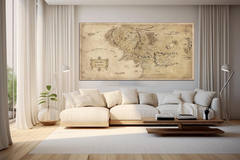 May include: A vintage-style map of Middle-earth, the fictional world from J.R.R. Tolkien's The Lord of the Rings, hangs on a white wall above a cream-colored couch in a living room.