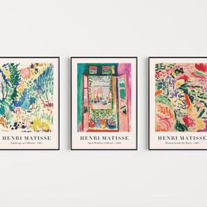 May include: Three framed art prints featuring colorful paintings by Henri Matisse. The first print shows a landscape with trees and a path, the second print shows a window with a view of boats, and the third print shows a woman standing by the water.