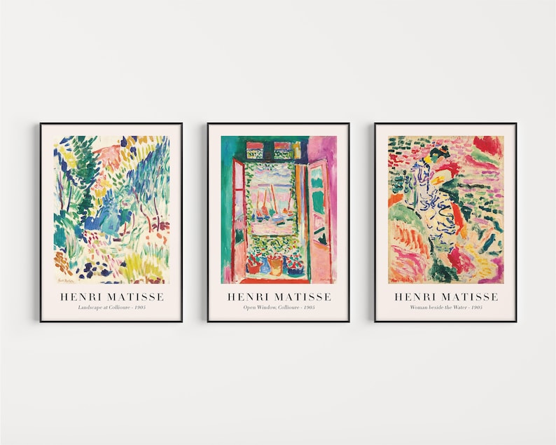 May include: Three framed art prints featuring colorful paintings by Henri Matisse. The first print shows a landscape with trees and a path, the second print shows a window with a view of boats, and the third print shows a woman standing by the water.