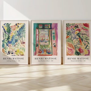 May include: Three framed art prints featuring colorful abstract paintings by Henri Matisse. The prints are titled "Landscape at Collioure", "Open Window, Collioure", and "Woman Beside the Water".