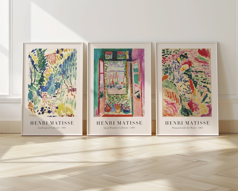 May include: Three framed art prints featuring colorful abstract paintings by Henri Matisse. The prints are titled "Landscape at Collioure", "Open Window, Collioure", and "Woman Beside the Water".