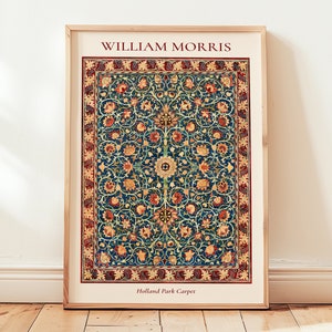 May include: A framed print of a vintage William Morris Holland Park Carpet design. The carpet features a repeating pattern of stylized flowers and leaves in shades of red, yellow, blue, and green on a dark blue background.
