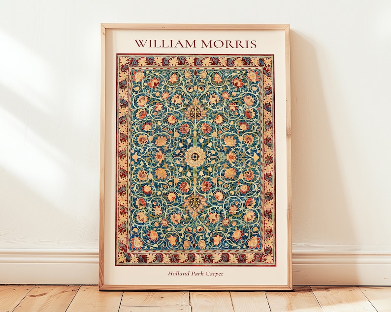 May include: A framed print of a vintage William Morris Holland Park Carpet design. The carpet features a repeating pattern of stylized flowers and leaves in shades of red, yellow, blue, and green on a dark blue background.
