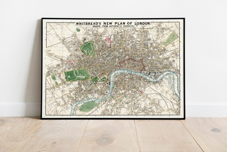 May include: A vintage map of London, England, titled "Whitbread's New Plan of London, Drawn from Authentic Surveys". The map is printed in black and white with green and blue accents. The map shows the River Thames winding through the city.