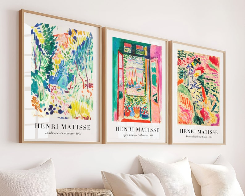 May include: Three framed art prints featuring colorful abstract paintings by Henri Matisse. The prints are titled "Landscape at Collioure - 1905", "Open Window, Collioure - 1905", and "Woman Beside the Water - 1905".