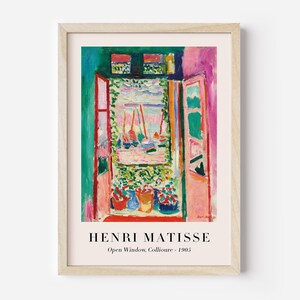 May include: A painting by Henri Matisse titled "Open Window, Collioure - 1905". The painting depicts a view from a window with a pink wall, a red door, and a green landscape with boats in the distance.