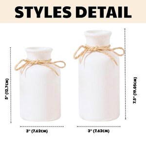 May include: Two white ceramic vases with a rustic rope detail around the neck. The smaller vase is 5 inches (12.7 cm) tall, and the larger vase is 7.5 inches (19.05 cm) tall. Both vases are 3 inches (7.62 cm) wide. The text "STYLES DETAIL" is at the top.