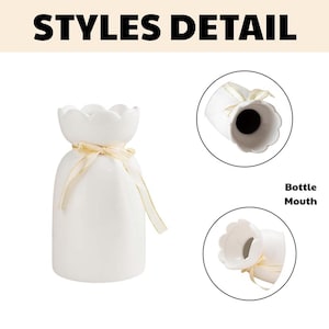 May include: A white ceramic vase with a scalloped top and a gold ribbon tied around the neck. The vase has a rounded body and a narrow neck. The text "STYLES DETAIL" is at the top of the image, and "Bottle Mouth" is written on the right.