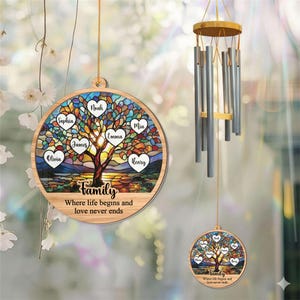 May include: A wooden family tree ornament with a stained-glass design. The tree has heart-shaped leaves with names and the text "Family Where life begins and love never ends". A silver wind chime hangs nearby.