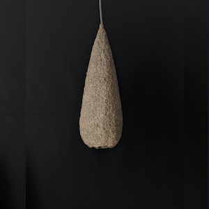 Paper pulp lamp. Long sagging shape. Beige colour. Natural materials. vegan. Model 11