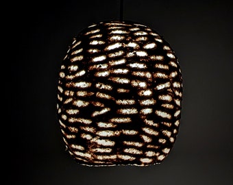Light beige paper pulp lamp with horizontal clearances in the shell.  Wege. Model 27.