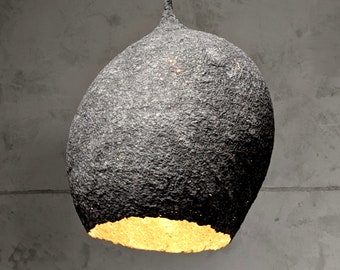 Lamp made of gray paper pulp. The irregular oval of the lampshade resembles a drop or lump of concrete. Natural materials. Vege. Model 20.