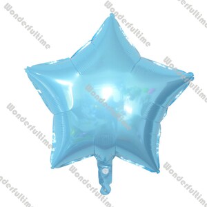 May include: A light blue star-shaped foil balloon. The balloon is inflated and ready to be tied.