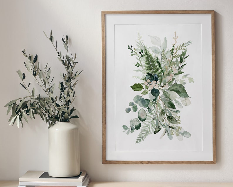 May include: A framed watercolour print of a green floral bouquet with white flowers and blue berries. The bouquet is arranged in a loose, natural style and is set against a white background.