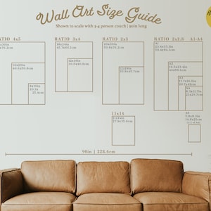 May include: A guide to wall art sizes, shown to scale with a 90-inch long couch. The guide includes different ratios, such as 4x5, 3x4, 2x3, and 2x2.8, with corresponding measurements in inches and centimeters.