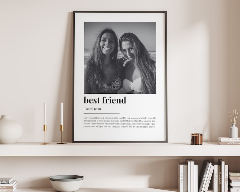 May include: Black and white photo of two friends on a beach. The photo is framed and has the word "best friend" written below it with a definition.