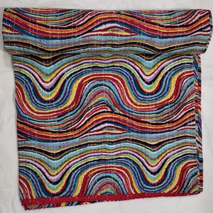 May include: A colorful kantha quilt with a wavy pattern in shades of red, blue, yellow, green, and purple. The quilt is made of cotton and is hand-stitched.