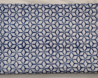 May include: A white fabric with a blue geometric pattern. The pattern is made up of small diamonds and circles.