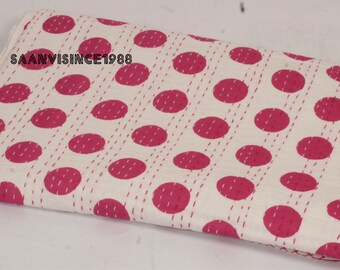 May include: White fabric with a pink polka dot pattern. The fabric is folded in half and the text "SAANVISINCE1988" is visible in the top left corner.