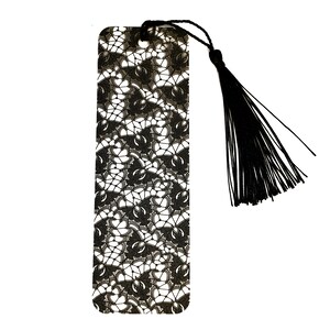 May include: Black and white lace bookmark with a black tassel.