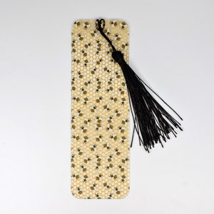 a yellow bookmark with a black tassel