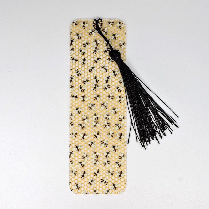 a yellow bookmark with a black tassel