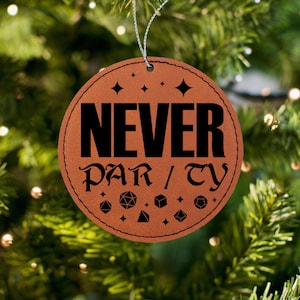 May include: A brown leather Christmas ornament with the text "NEVER PARTY" in black lettering. The ornament is decorated with dice and stars.