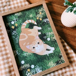 Beautiful wall art of your personalised hand-drawn cat illustrated so that it is sitting in grass and wildflowers.