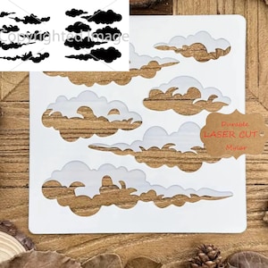 May include: White plastic stencil with multiple cloud shapes cut out. The stencil is on a wooden surface. The text "Durable Laser Cut Mylar" is on a brown tag.