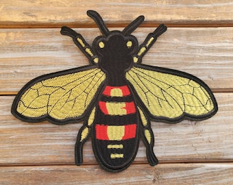 gucci bee logo meaning