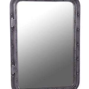 May include: Rectangular mirror with a dark gray metal frame. The frame has rounded corners and is secured with rivets. The mirror has a hinged side and a reflective surface, suitable for home decor.