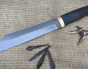 The knife is made of Viking arrowheads.Viking knife &quot;Seax&quot; from 1000 year old arrowheads.