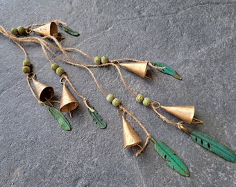 Windchime with cow bells on a string with olive green crackle beads and patina brass feather pendants, witch bells, door hanger, suncatcher