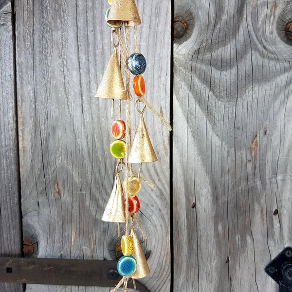 1 Windchime with 6 rustic cone shaped cow bells and colorful ceramic beads, bells on a string, doorknob hanger, bronze gold brass handmade
