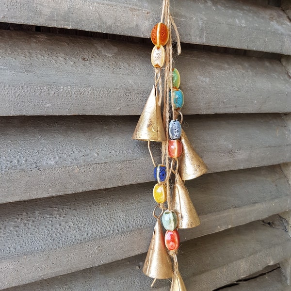 Doorknob windchime with 5 rustic cone shaped cow bells on a string and colorfull ceramic stone bead, bronze copper gold brass metal handmade