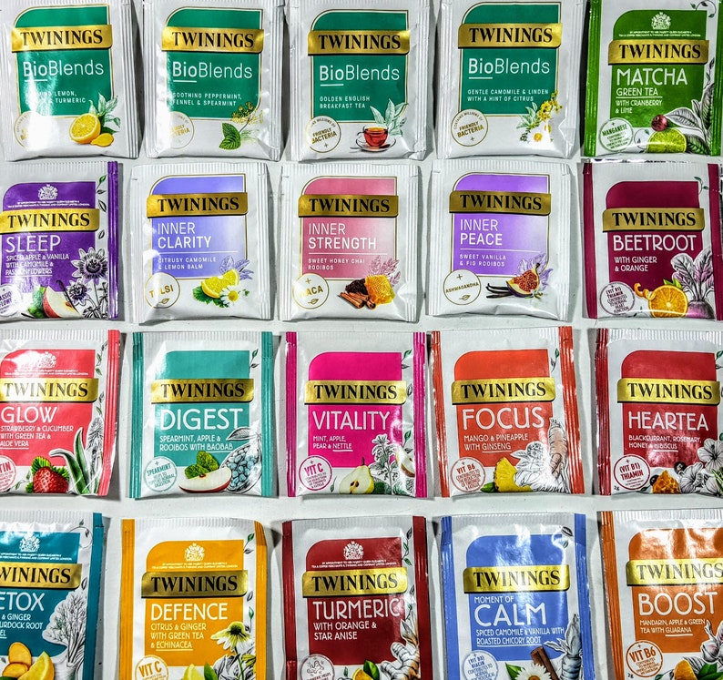 May include: A collection of 20 different Twinings tea bags, each with a unique blend and flavor. The tea bags are arranged in a grid pattern, with each bag featuring a different color and design. The tea bags are all labeled with the Twinings logo and the name of the blend.