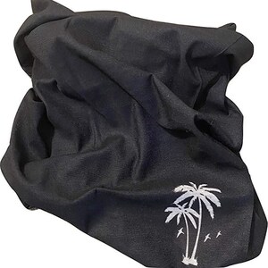 May include: Black cotton face mask with a white palm tree design.