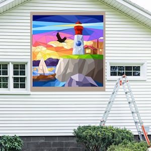 May include: A colorful geometric mosaic wall art featuring a lighthouse on a cliff with a sailboat in the water. The sky is a vibrant sunset with a bird flying overhead.